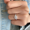 1 Ct Moissanite & .14 Ctw Diamond Adore Three Stone Engagement Ring